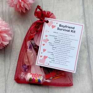 Boyfriend Survival Kit novelty gift in an organza bag with a laminated label explaining each item