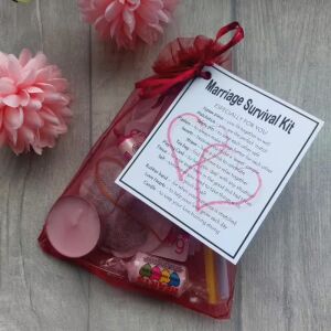 Marriage Survival Kit in a red organza bag with laminated label, a novelty gift for newlyweds and wedding couples