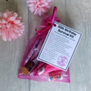 30th Birthday Survival Kit Gift in hot pink organza bag with laminated label explaining each survival item