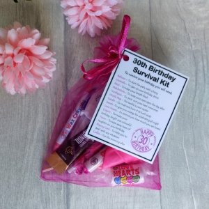 30th Birthday Survival Kit Gift in hot pink organza bag with laminated label explaining each survival item