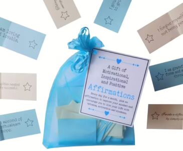 Handmade affirmation gift bag with 31 positive quotes printed on coloured paper, packaged in organza with laminated label