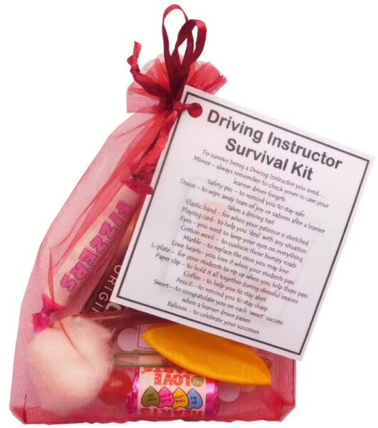 Driving Instructor Survival Kit in dark red organza bag with laminated label explaining each symbolic item