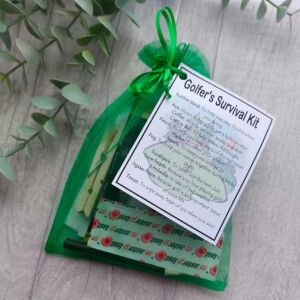 Golfer's novelty survival kit in green organza bag with laminated label showing gift items and humorous descriptions