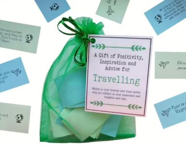 Handmade travel gift bag filled with 32 folded inspirational quotes and travel sayings in an organza bag, packaged in cellophane with a laminated label