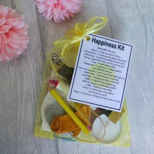 Happiness Kit Gift in yellow organza bag with laminated label showing meaningful messages for each item inside
