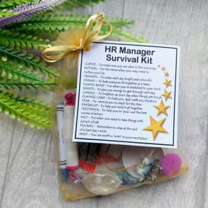 Hand-made HR manager survival kit in organza bag with laminated label showing humorous survival items for human resources professionals