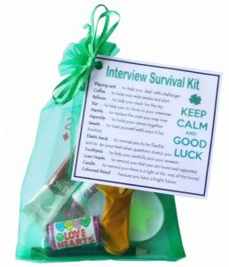 Interview Survival Kit in green organza bag with laminated label explaining each symbolic item