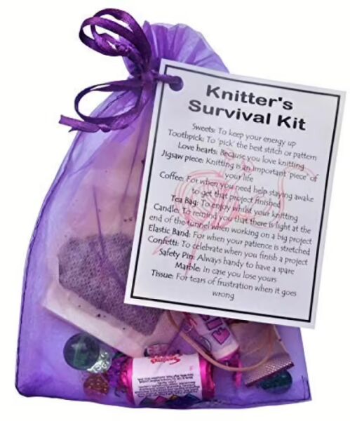 Purple organza bag containing novelty survival kit items for knitters with laminated humour label