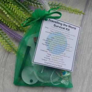 Blue organza bag Travelling the World Survival Kit with laminated label showing symbolic items for world travel